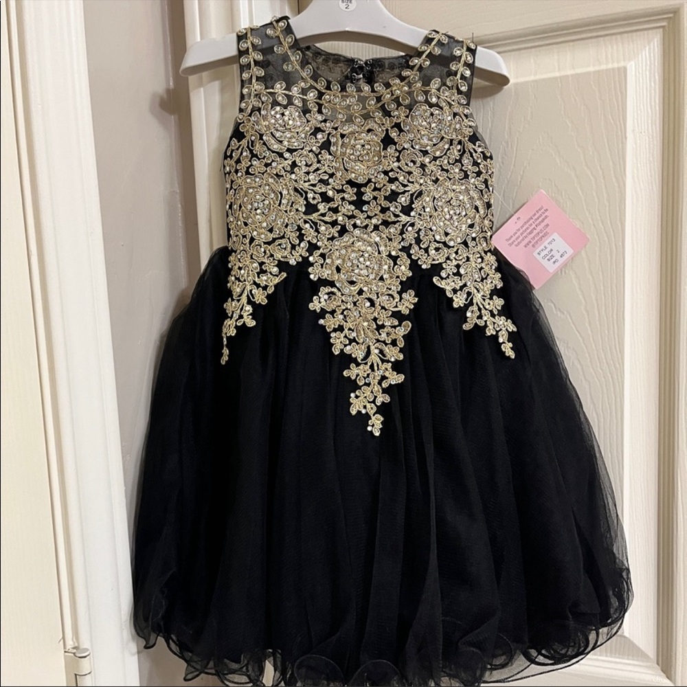 Black and Gold formal dress size 2t, only worn once .